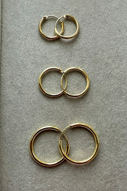 14ct gold hoops. 12mm, 15mm and new 20mm hoops. flat lay
