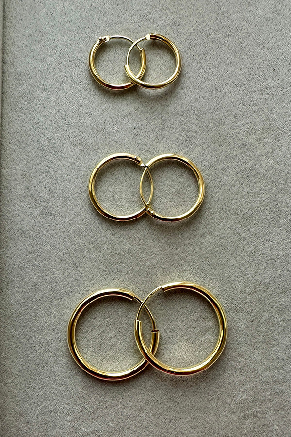 14ct gold hoops. 12mm, 15mm and new 20mm hoops. flat lay