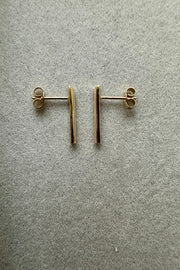 A pair of Edge Only 9 carat gold D Bar Earrings. Side view. 100% recycled gold