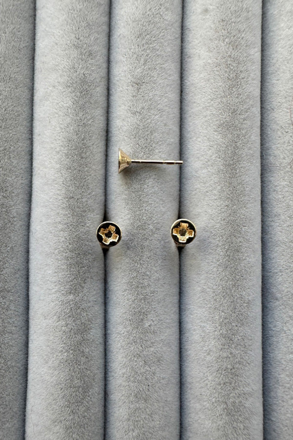 Edge Only mini Cross-head screw earrings in solid 100% recycled 14 carat gold on grey velvet