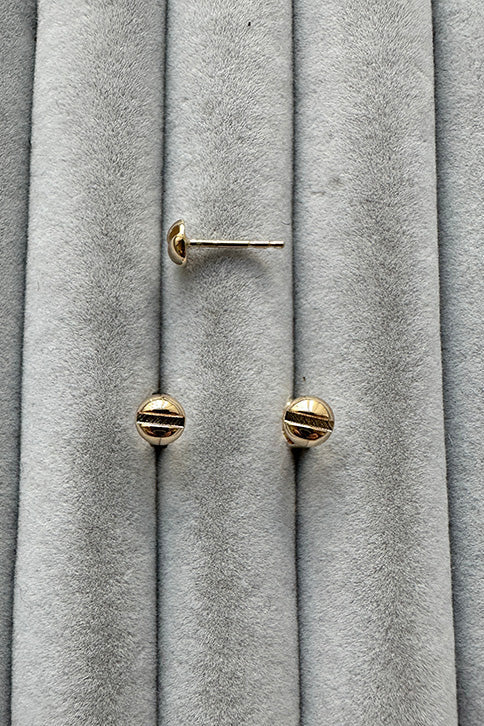 Edge Only Mini Flat-head Screw Earrings in solid 14 carat recycled gold on grey velvet