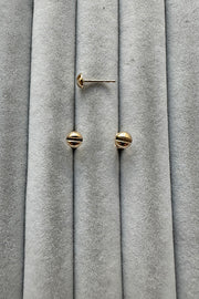 Edge Only Mini Flat-head Screw Earrings in solid 14 carat recycled gold on grey velvet
