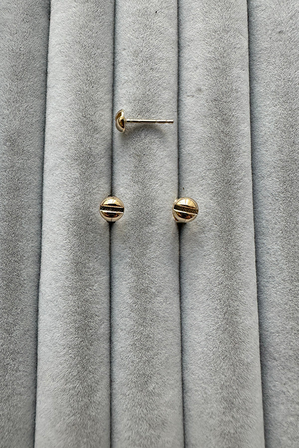 Edge Only Mini Flat-head Screw Earrings in solid 14 carat recycled gold on grey velvet