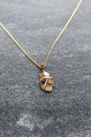 Edge Only Rock Pendant in 18ct gold vermeil (recycled sterling silver) on marble