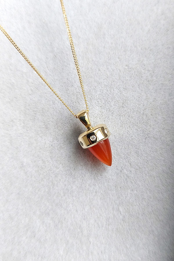 Edge Only 9ct gold Carnelian and Diamond Pendant on velvet. Sustainable recycled gold. 