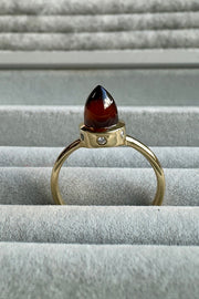 Edge Only Hessionite Garnet and Diamond Bullet Ring in 9ct gold on grey velvet