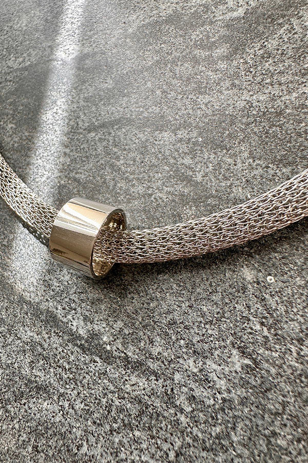 Edge Only Circular Bead Mesh Necklace. Recycled sterling silver tubular bead close up