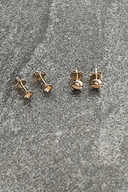 Edge Only mini Cross-head screw earrings and Mini Flat-head Screw Earrings in solid 100% recycled 14 carat gold 