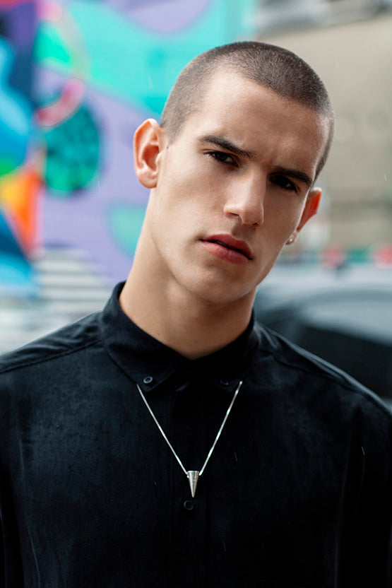 male model wearing a button down black shirt and Edge Only Cone Pendant in recycled Sterling Silver 24"/60cm