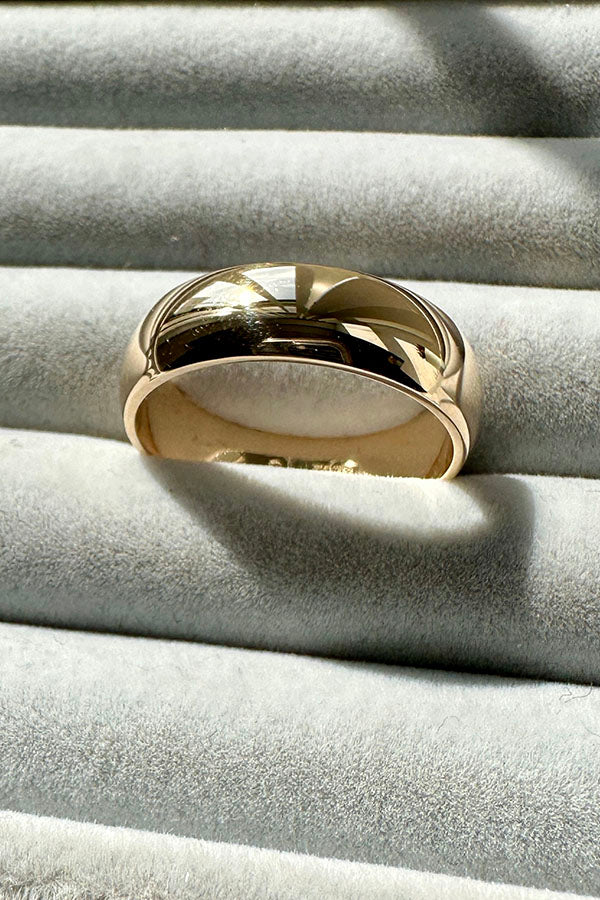 Edge Only 9ct gold 6mm D Shaped Band in grey velvet tray. 100% recycled gold