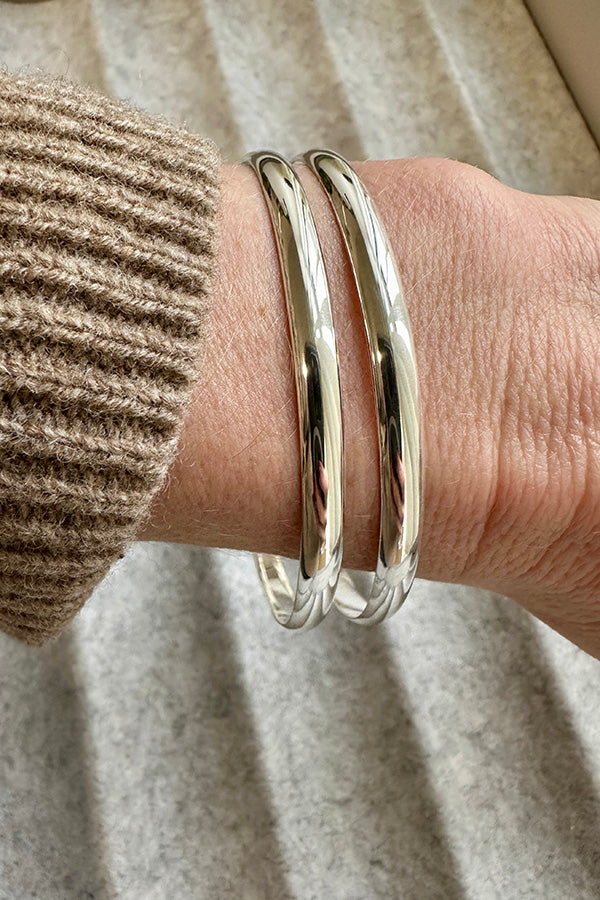 pair of Edge Only 4.5mm Bangles sterling silver, on wrist