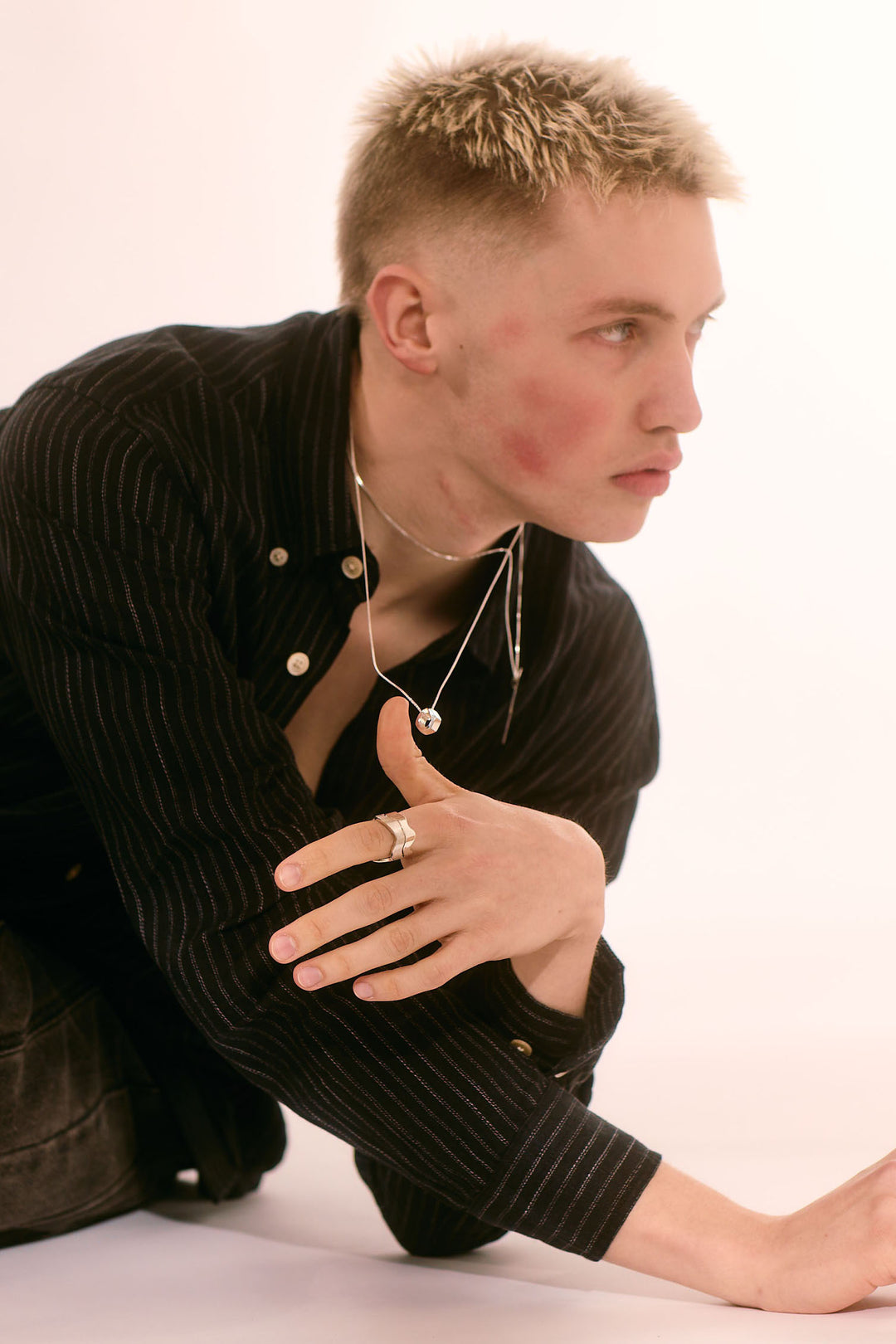 Edge Only Hex Nut Pendant and Flat Top Lightning Bolt Pendant sterling silver. Declan Kelly editorial shoot