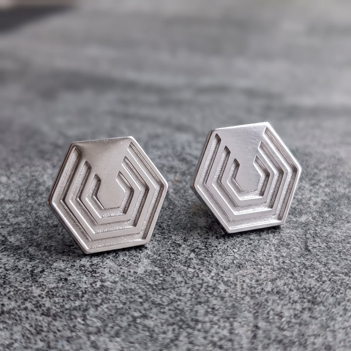 Edge Only Hexagon Earrings in recycled sterling silver on grey marble