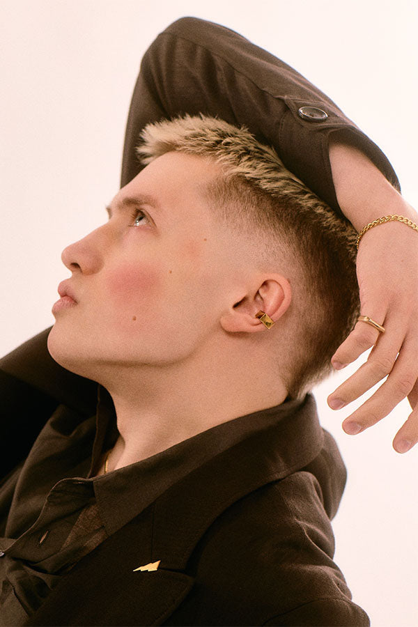 Edge Only Square Ear Cuff 18ct gold vermeil, Flat Curb Bracelet 18ct gold vermeil Rooftop Ring 14ct gold and Triple Bolt Pin 18ct gold vermeil . Declan Kelly jewellery editorial