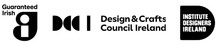 A black and white graphic banner featuring logos for 'Guaranteed Irish', 'Design & Crafts Council Ireland', and 'Institute Designers Ireland' on a solid white background.