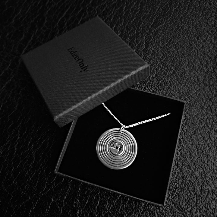 Sterling Silver Vinyl Pendant in Edge Only jewellery gift box. Shows side A with a lightning bolt.