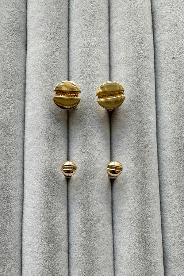 Edge Only Flat Head Screw Earrings 18ct gold vermeil above Edge Only Mini Flat-head Screw Earrings in solid 14 carat recycled gold. on grey velvet