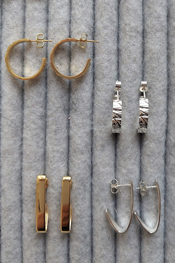 Edge Only Rugged Hoops and V Fold Earrings on grey tray