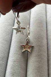Edge Only Mini Megastar Drop Earrings recycled sterling silver held in fingers