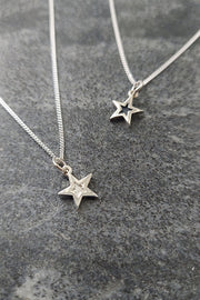 Mini Megastar pendants in recycled sterling silver and oxidised sterling siver