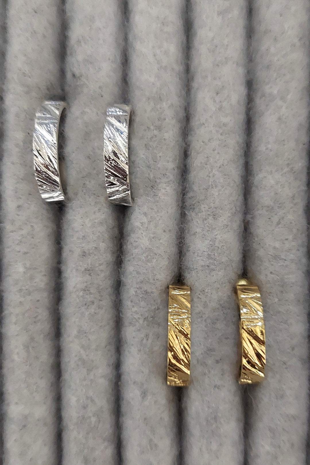 Edge Only Rugged Hoop Earrings in recycled sterling silver and 18ct gold vermeil on grey display tray