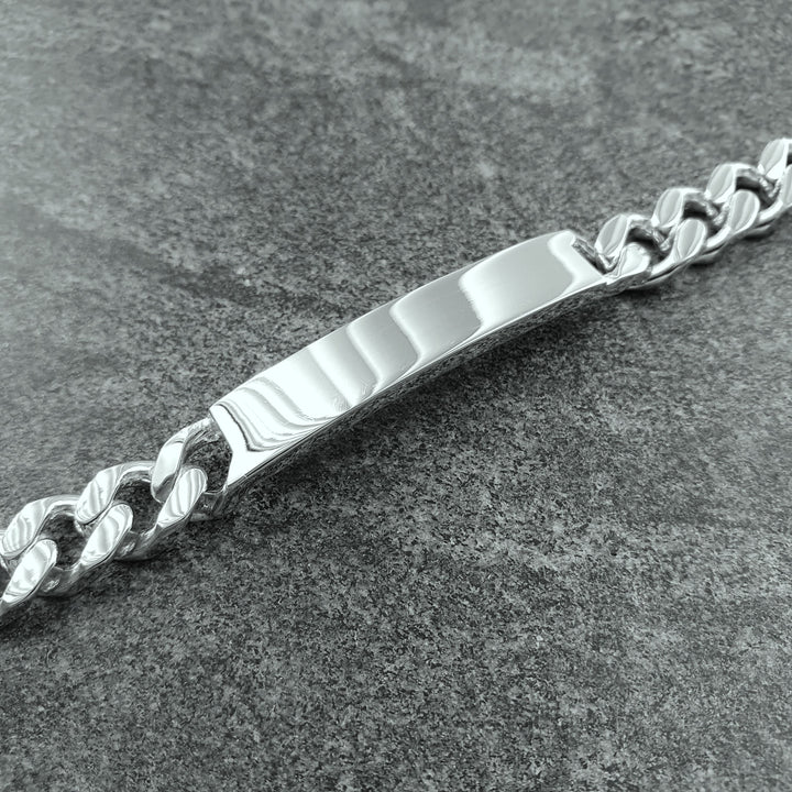 Edge Only Heavy Curb ID Bracelet in sterling silver on marble